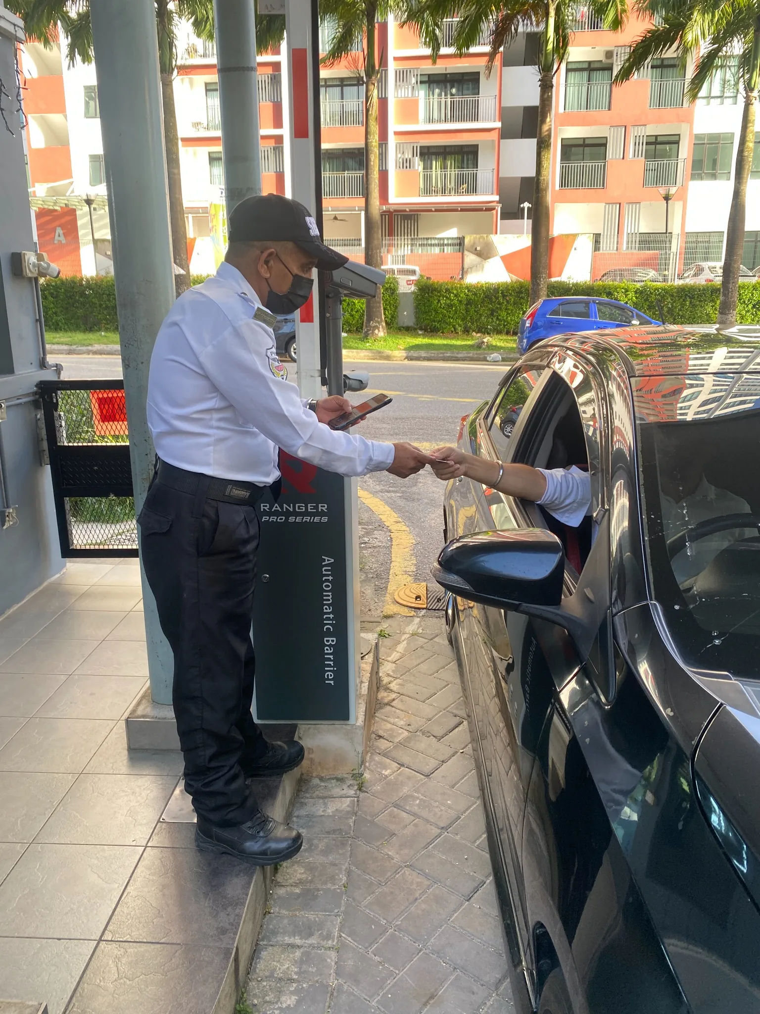 Security guard managing vehicle access