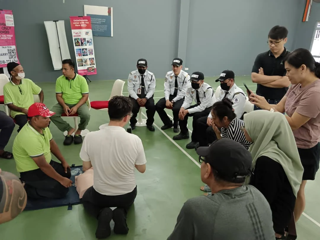 Security personnel attending CPR training with site staff